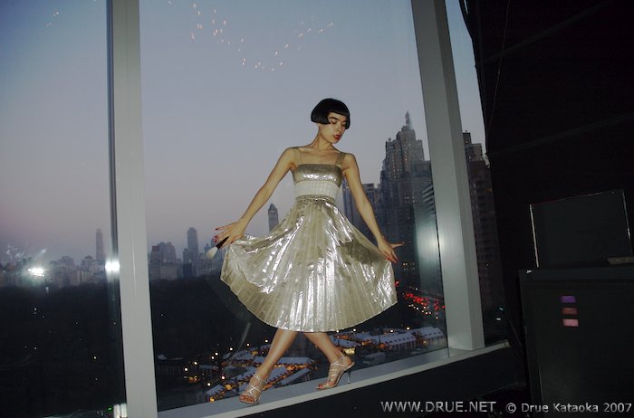 Drue steps across Columbus Circle on the edge of Dizzy's